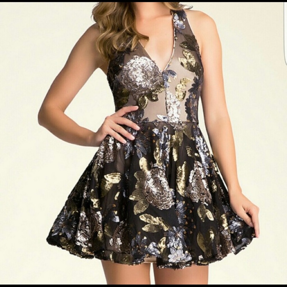 Gorgeous BEBE fit & flare sequin dress! This dress is a show stopper!